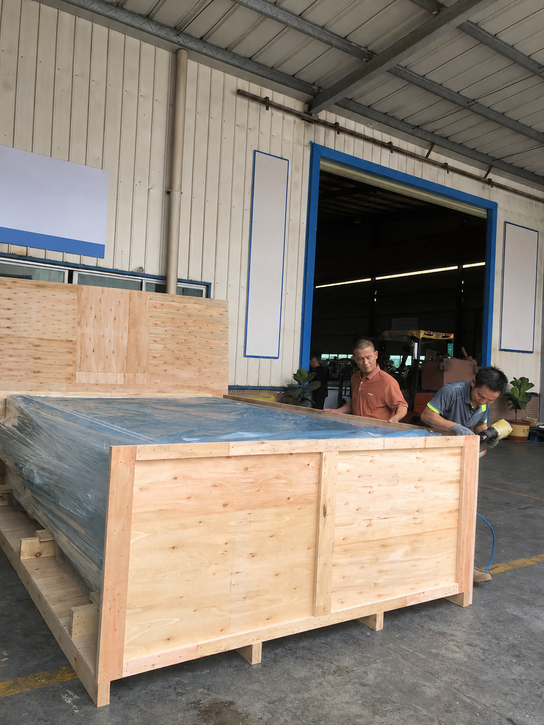 Foam cutting machine wooden crate packaging before international shipment